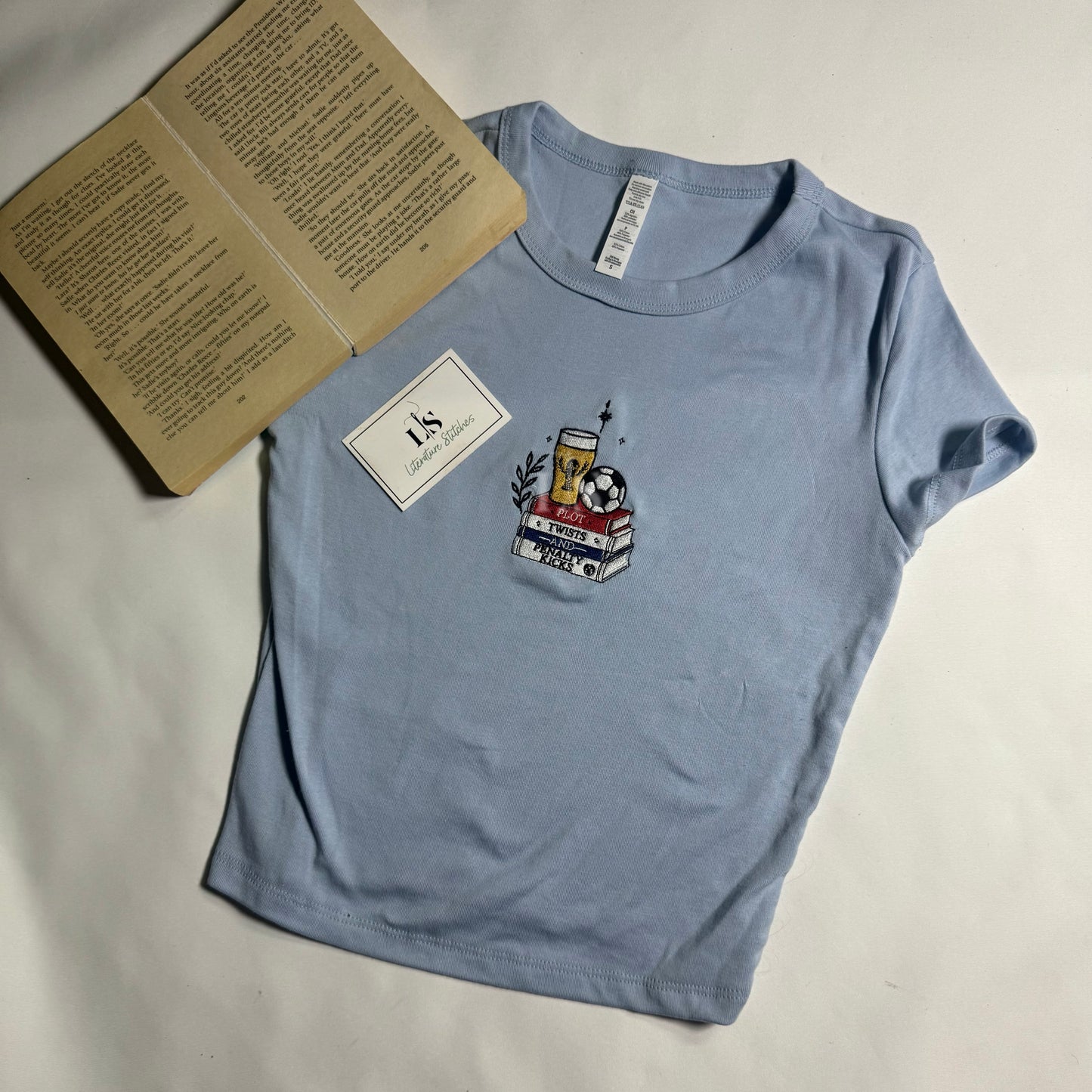 Plot twists and Penalty Kicks Baby Tee